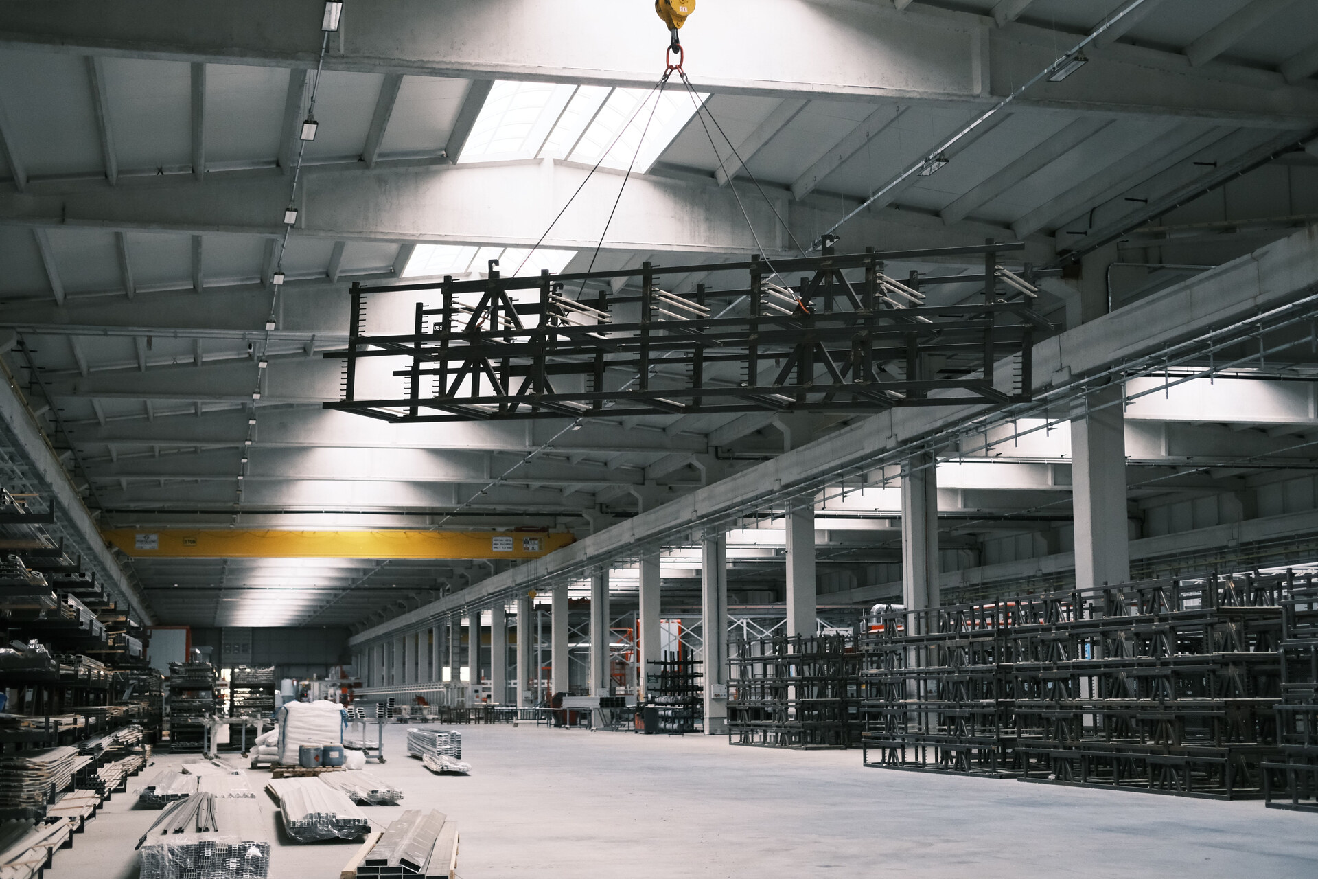 Interior of an industrial facility with overhead crane and steel structures