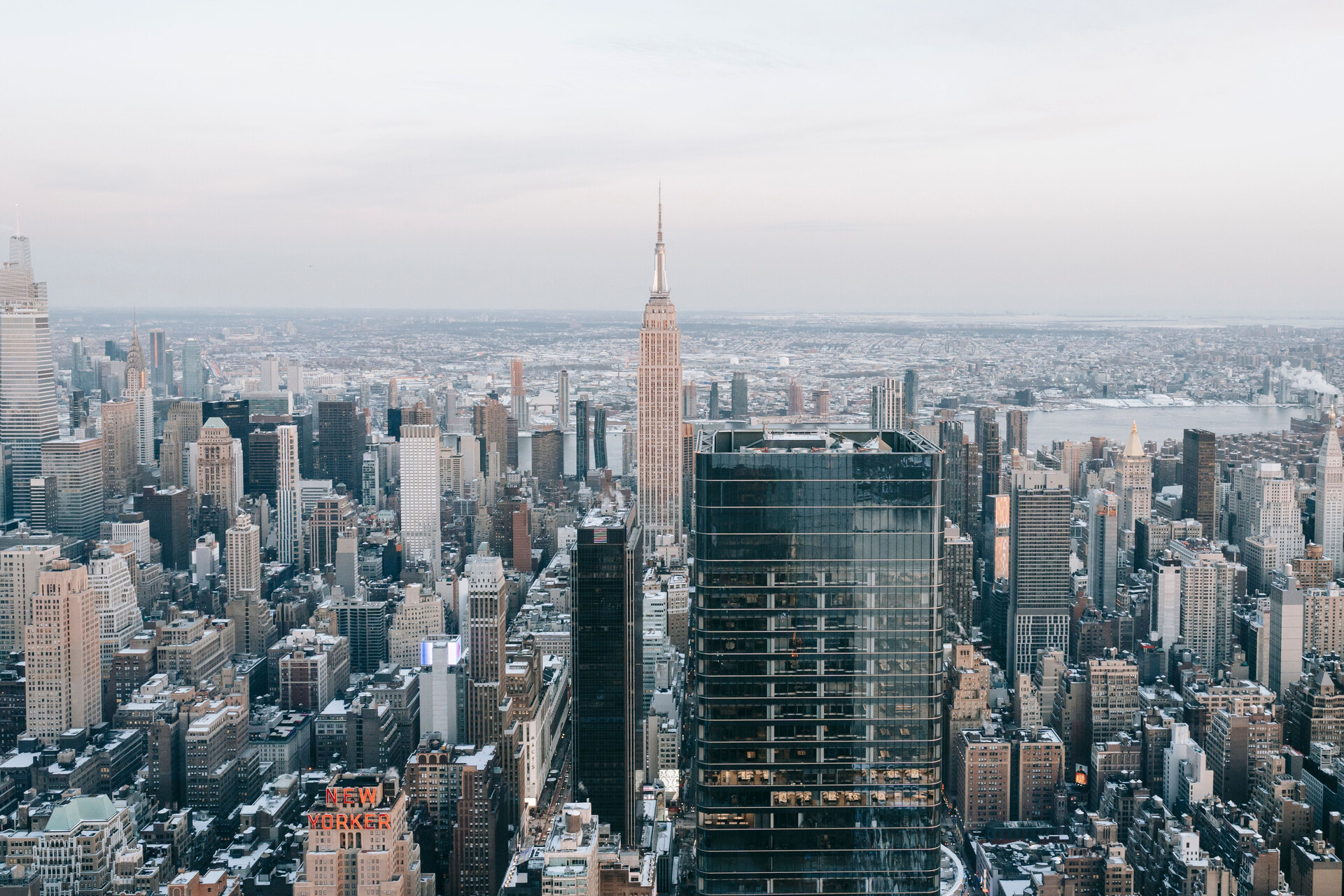 Elevated view of Manhattan with glass and steel skyscrapers and the Empire State Building in the background